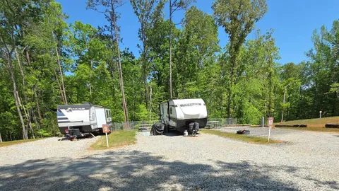 Campsite #10  RV/ Tent site Full Hookup 45' x 18' Level Gravel Pad with Fenced in Back Yard, Back In — image 2 of 6