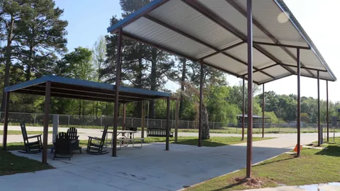 Pull Thru Covered Pavilion RV Site with Deluxe Covered Patio, Fire Pit, Grill & Swing — image 2 of 2