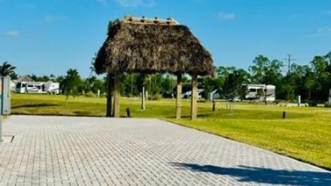 Lakefront Pull-In RV Site w/Tiki Hut — image 1 of 10