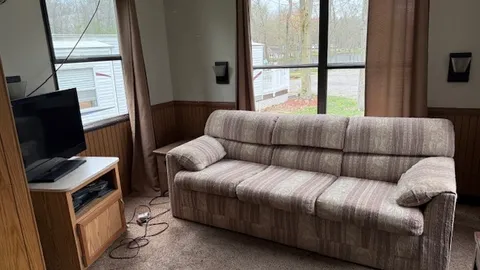 Mainstreet Cabin: Sleeps 6 Family Cabin — Covered Deck & Room for Everyone to Spread Out — image 2 of 8