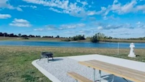 30/50 Amp Deluxe Concrete Full Hookup Waterfront RV Site — image 2 of 3