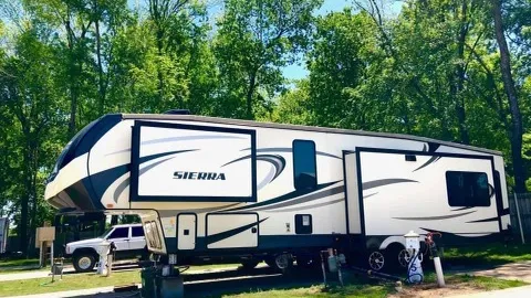 Deluxe Full Hookup Back-In Site with Shade — image 1 of 1