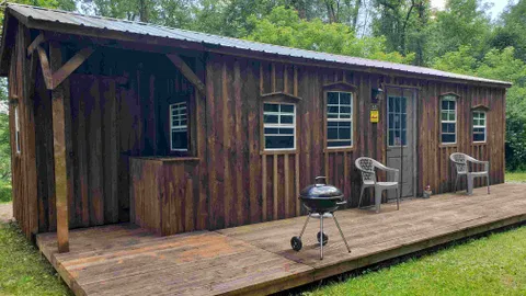 Deluxe Woodchuck Cabin - Sleeps 6 — image 1 of 11