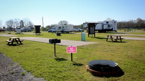 Full Hook-Up Back-In RV Site — image 1 of 26