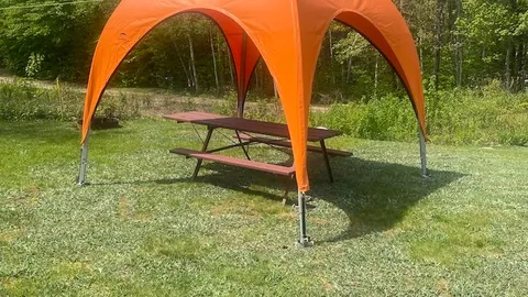 Open Grass Tent Site with Canvas Awning — image 2 of 3