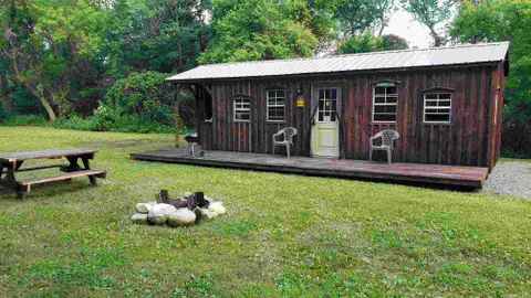 Deluxe Woodchuck Cabin - Sleeps 6 — image 2 of 11