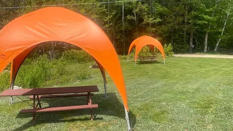 Open Grass Tent Site with Canvas Awning — image 1 of 3