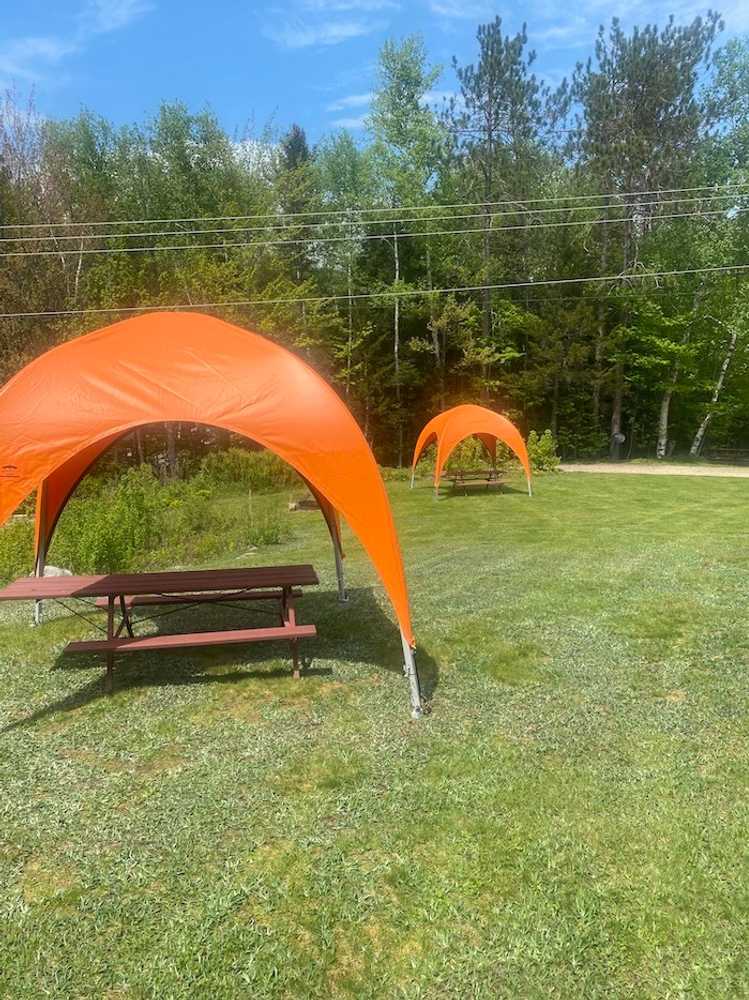 Open Grass Tent Site with Canvas Awning