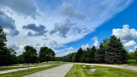 Deluxe Full Hookup Pull-Thru RV Site with Concrete Pad — image 1 of 26