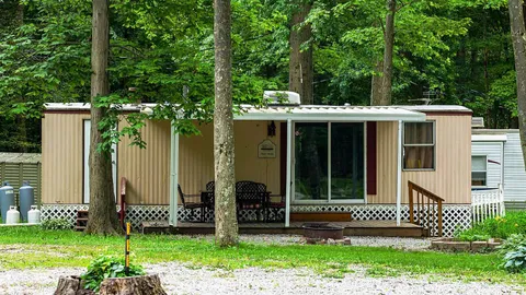 Mainstreet Cabin: Sleeps 6 Family Cabin — Covered Deck & Room for Everyone to Spread Out — image 1 of 8