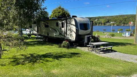 Full Service - 30 Amp, Water & Sewer Back-In RV Site - River/Sunset View — image 1 of 1