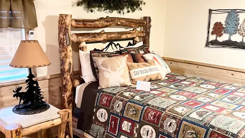 #4 Deluxe Themed Outdoors Cabin — image 1 of 3