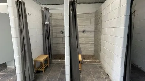 Deluxe Full Hookup Back In RV Site with Concrete Pad — image 2 of 27