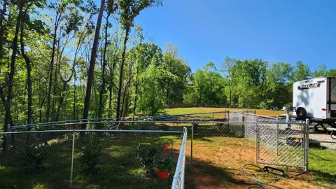 Campsite #8 RV/ Tent Site Full Hook Up 60’ x 18’ Level Gravel Pad with Fenced in Back Yard, Side Yard, Private path to trails, Back In — image 2 of 9