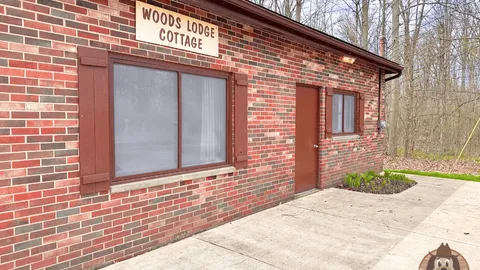 WOODSLODGE (SLEEPS 12) — image 1 of 18