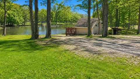 Lakefront Back-In RV Site — Water & Electric with Patio Right on the Shore — image 1 of 4