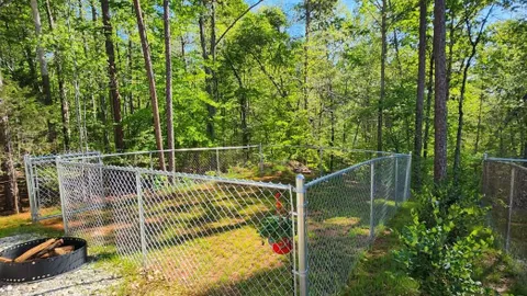 Campsite #8 RV/ Tent Site Full Hook Up 60’ x 18’ Level Gravel Pad with Fenced in Back Yard, Side Yard, Private path to trails, Back In — image 1 of 9
