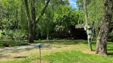 [50/30 Amp FHU] Stream-Side Back-In Site — image 1 of 7