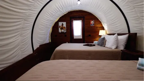Covered Wagon with 2 Queen Beds — image 2 of 9