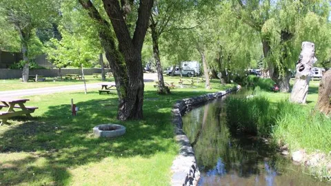 Back-in Leisure Creekside RV Site — image 1 of 12