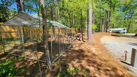 Campsite #6 RV/ Tent  Site Full Hook Up, 60’ x 18’ Level Gravel Pad with Back Yard and Shaded Fenced Enclosure for your Pets, Pull Through — image 11 of 11
