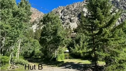 Hut B (water, electric) — PREMIUM partial hookup campsite close to lake — image 3 of 3