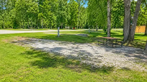 Water & Electric Back-In RV Site — Peaceful Setting with Patio & 30/50 Amp — image 1 of 6