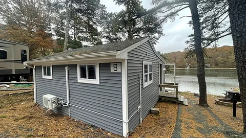 Premiere Waterfront Cabin 1 bedroom with sleeping porch — image 1 of 7