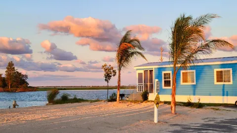 Beachside Waterfront Deluxe Cottage — image 1 of 8