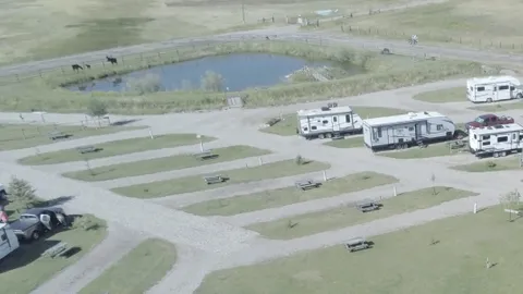 Basic Pull Thru Water/Electric RV Site — image 1 of 2