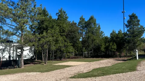 DELUXE FULL HOOK-UP BACK-IN SHADED RV SITE — image 2 of 2