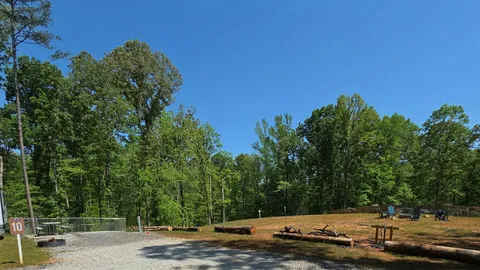 Campsite #10  RV/ Tent site Full Hookup 45' x 18' Level Gravel Pad with Fenced in Back Yard, Back In — image 6 of 6