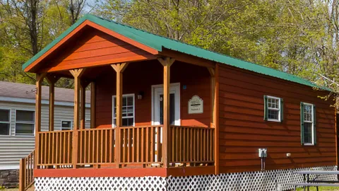 Deluxe Poolside Cabin: Sleeps 6 Poolside Cabin — Steps to Water, Built for Family Fun — image 1 of 7