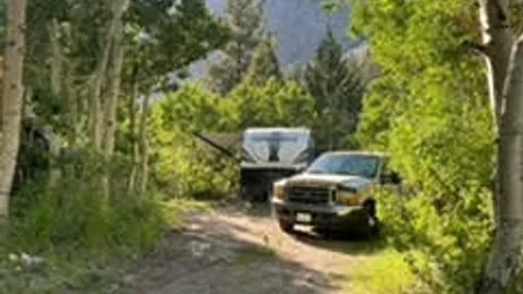 Hut B (water, electric) — PREMIUM partial hookup campsite close to lake — image 2 of 3