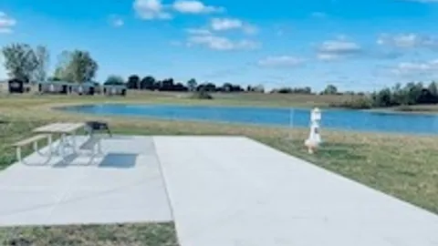 30/50 Amp Deluxe Concrete Full Hookup Waterfront RV Site — image 1 of 3